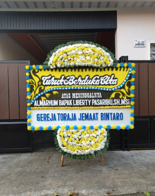 Papan Bunga Duka di Teruwai